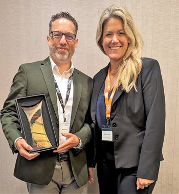 Jonah Keim accepting the award from Dr. Cook