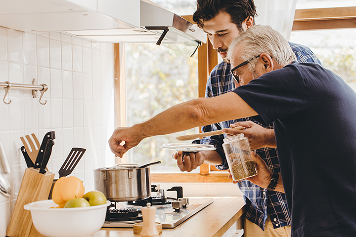 Two men cooking