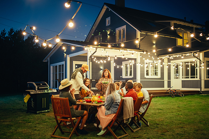 Family in backyard at night