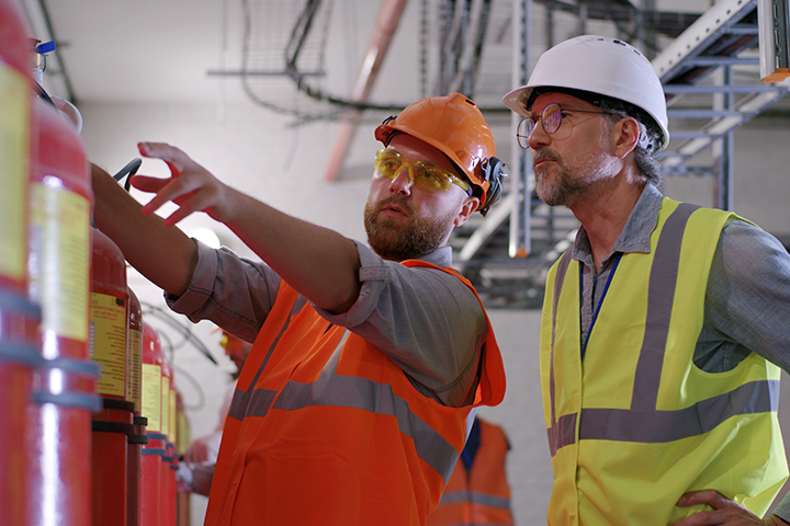 Two workers inside power plant