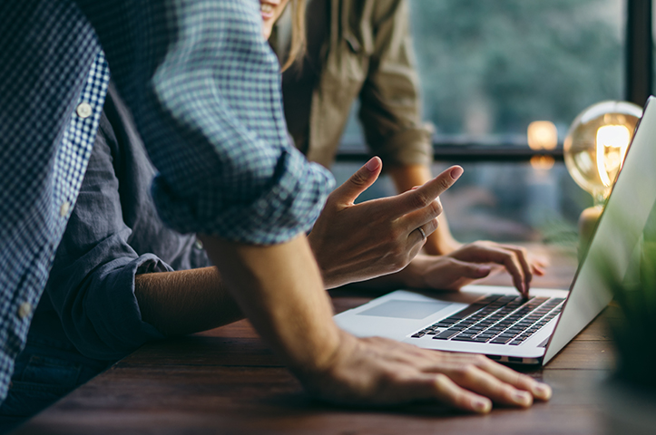 People collaborating near computer