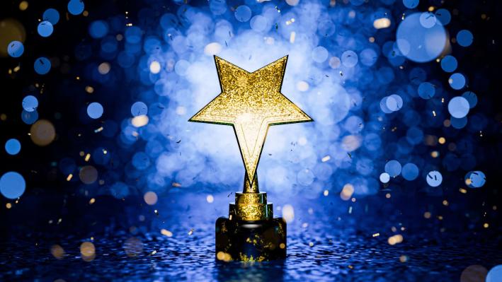 A star trophy with a blue background.