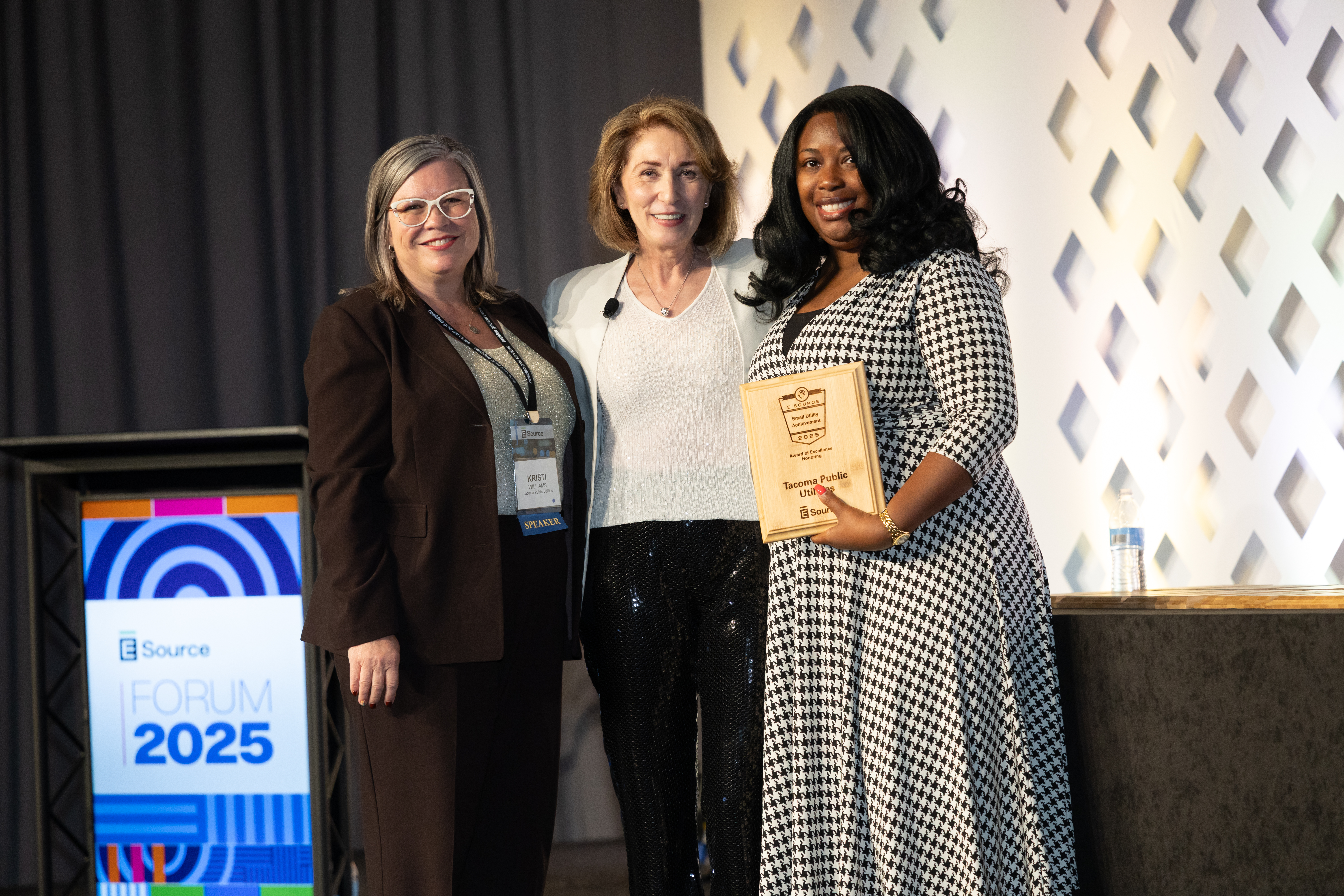 Attendees accepting the Small Utility Excellence Award at the Forum.